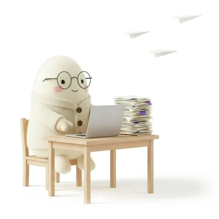 Drop typing at a laptop while paper planes fly off